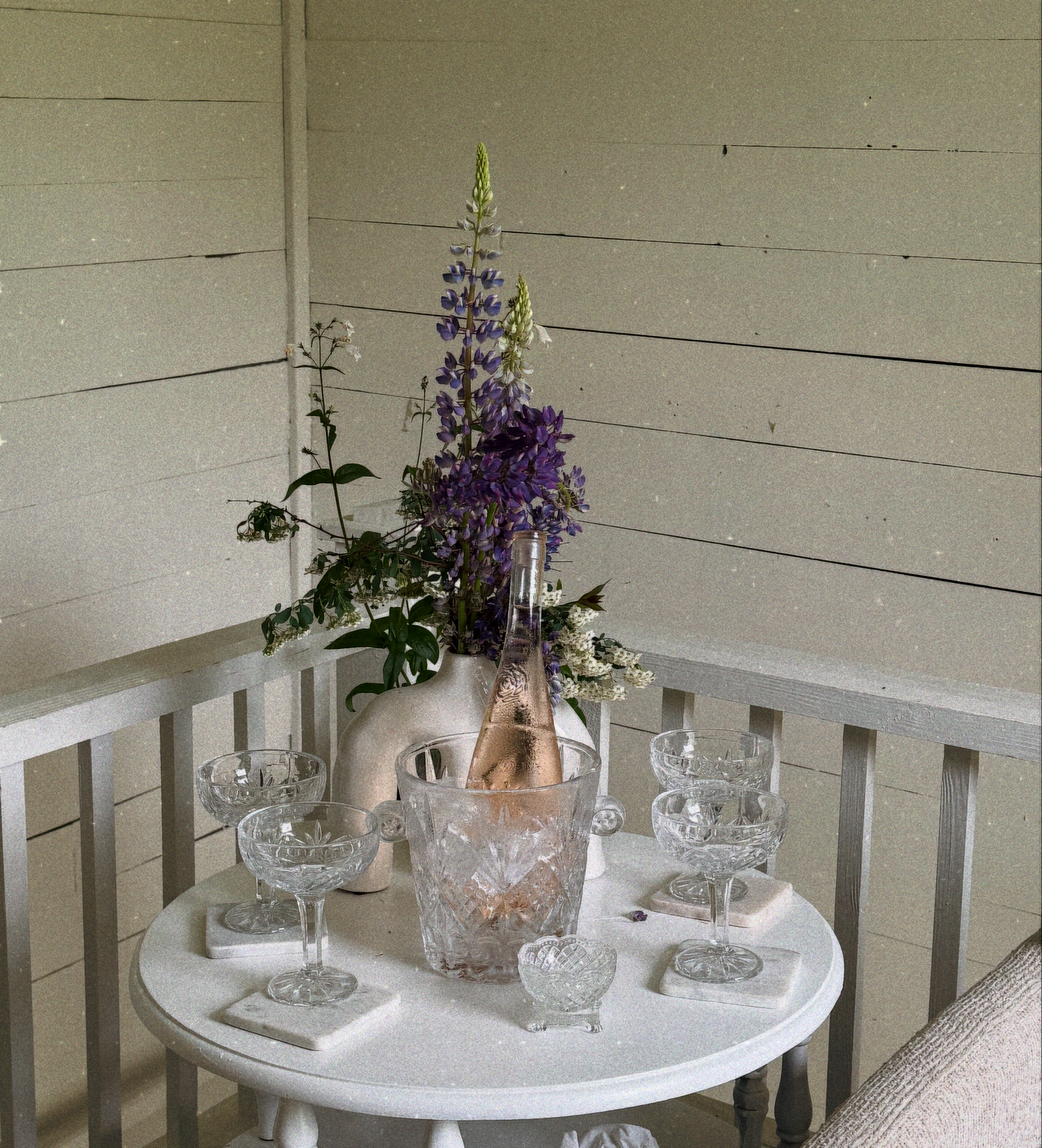 Porch with rosé and lupines